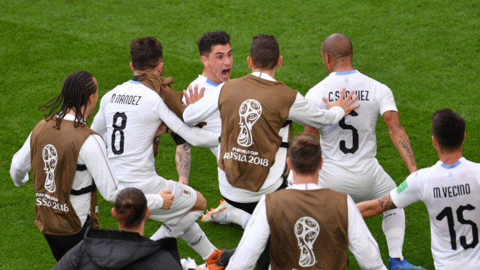 Uruguay's defender Jose Gimenez (C) celebrates with team-mates after scoring the opening goal during the Russia 2018 World Cup Group A football match between Egypt and Uruguay at the Ekaterinburg Arena in Ekaterinburg on June 15, 2018. (Photo by HECTOR RETAMAL / AFP) / RESTRICTED TO EDITORIAL USE - NO MOBILE PUSH ALERTS/DOWNLOADS (Photo credit should read HECTOR RETAMAL/AFP/Getty Images)