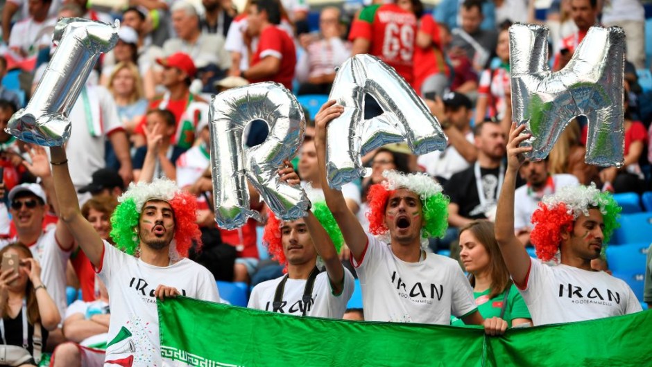 Iran fans cheer prior to the Russia 2018 World Cup Group B football match between Morocco and Iran at the Saint Petersburg Stadium in Saint Petersburg on June 15, 2018. (Photo by Paul ELLIS / AFP) / RESTRICTED TO EDITORIAL USE - NO MOBILE PUSH ALERTS/DOWNLOADS (Photo credit should read PAUL ELLIS/AFP/Getty Images)