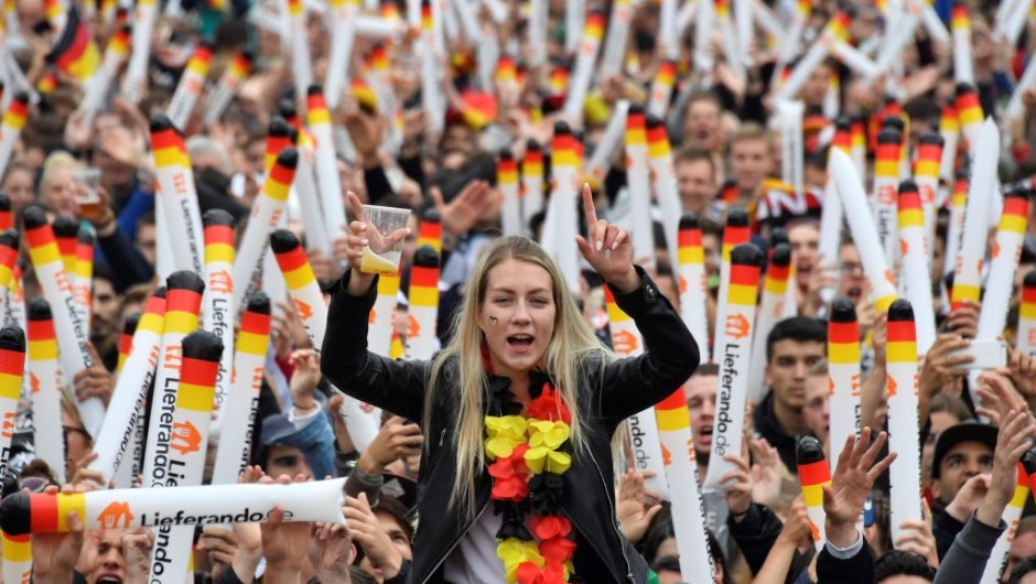 Supporters of the German national football team watch on a giant screen the Russia 2018 World Cup Group F football match between Germany and Sweden on June 23, 2018 in Berlin. (Photo by John MACDOUGALL / AFP) (Photo credit should read JOHN MACDOUGALL/AFP/Getty Images)