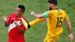 TOPSHOT - Australia's midfielder Mile Jedinak (R) fouls Peru's midfielder Christian Cueva during the Russia 2018 World Cup Group C football match between Australia and Peru at the Fisht Stadium in Sochi on June 26, 2018. (Photo by Odd ANDERSEN / AFP) / RESTRICTED TO EDITORIAL USE - NO MOBILE PUSH ALERTS/DOWNLOADS (Photo credit should read ODD ANDERSEN/AFP/Getty Images)