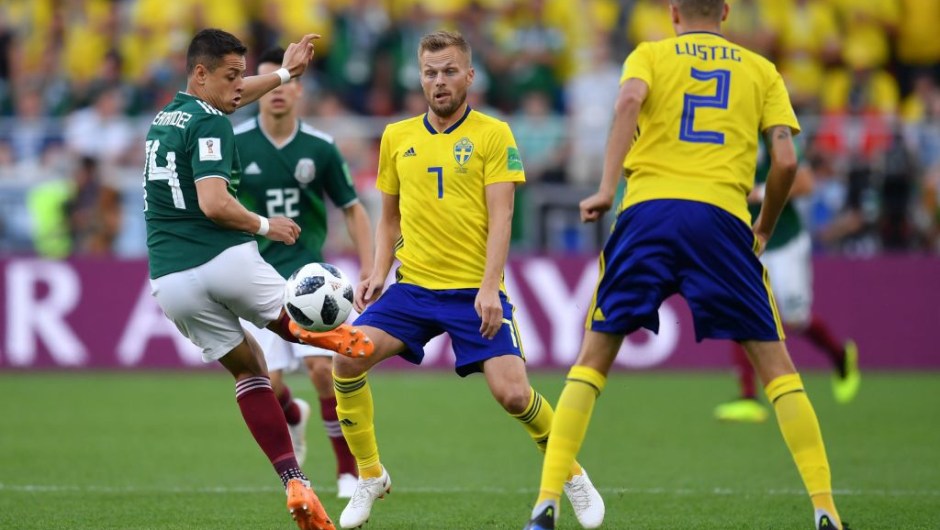 Mexico's forward Javier Hernandez and Sweden's midfielder Sebastian Larsson vie for the ball during the Russia 2018 World Cup Group F football match between Mexico and Sweden at the Ekaterinburg Arena in Ekaterinburg on June 27, 2018. (Photo by HECTOR RETAMAL / AFP) / RESTRICTED TO EDITORIAL USE - NO MOBILE PUSH ALERTS/DOWNLOADS (Photo credit should read HECTOR RETAMAL/AFP/Getty Images)