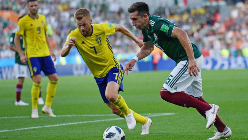 Sweden's midfielder Sebastian Larsson (L) and Mexico's midfielder Hector Herrera vie for the ball during the Russia 2018 World Cup Group F football match between Mexico and Sweden at the Ekaterinburg Arena in Ekaterinburg on June 27, 2018. (Photo by HECTOR RETAMAL / AFP) / RESTRICTED TO EDITORIAL USE - NO MOBILE PUSH ALERTS/DOWNLOADS (Photo credit should read HECTOR RETAMAL/AFP/Getty Images)