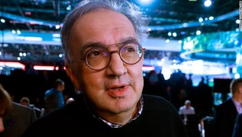 Sergio Marchionne, center, CEO of Fiat Chrysler Automobiles is interviewed after the unveiling of the new 2019 Jeep Cherokee during the North American International Auto Show, Tuesday, Jan. 16, 2018, in Detroit. (AP Photo/Carlos Osorio)