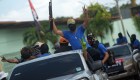 TOPSHOT - Paramilitaries flash the "V" sign from a truck at Monimbo neighborhood in Masaya, Nicaragua, on July 18, 2018, following clashes with anti-government demonstrators. - The head of the Inter-American Commission on Human Rights has described as "alarming" the ongoing violence in Nicaragua, where months of clashes between protesters and the forces of President Daniel Ortega have claimed almost 300 lives. (Photo by MARVIN RECINOS / AFP) (Photo credit should read MARVIN RECINOS/AFP/Getty Images)