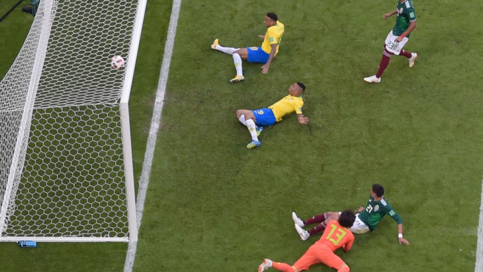 Brazil's forward Neymar (top, C) scores a goal during the Russia 2018 World Cup round of 16 football match between Brazil and Mexico at the Samara Arena in Samara on July 2, 2018. (Photo by - / AFP) / RESTRICTED TO EDITORIAL USE - NO MOBILE PUSH ALERTS/DOWNLOADS (Photo credit should read -/AFP/Getty Images)
