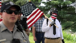 VIENNA, VA - AUGUST 12: Fairfax County Police escort white supremacists as they walk toward the Vienna/Fairfax GMU Metro Station to travel by train to the White House for the Unite the Right rally August 12, 2018 in Vienna, Virginia. Thousands of protesters are expected to demonstrate against the "white civil rights" rally in Washington, which was planned by the organizer of last year's deadly rally in Charlottesville, Virginia. (Photo by Chip Somodevilla/Getty Images)