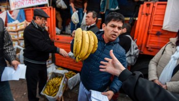 Producers give bananas for free during a protest at Plaza de Mayo square near the Casa Rosada presidential palace in Buenos Aires, on August 2, 2017. Banana producers gave away 30 tons of the fruit in demand of government assistance to try to reverse the complicated scenario that the domestic market is facing due to the importation of products at a very low price. / AFP PHOTO / Eitan ABRAMOVICH (Photo credit should read EITAN ABRAMOVICH/AFP/Getty Images)