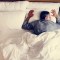 French man sleeping alone on bed; Shutterstock ID 1070512514; Job: sleep