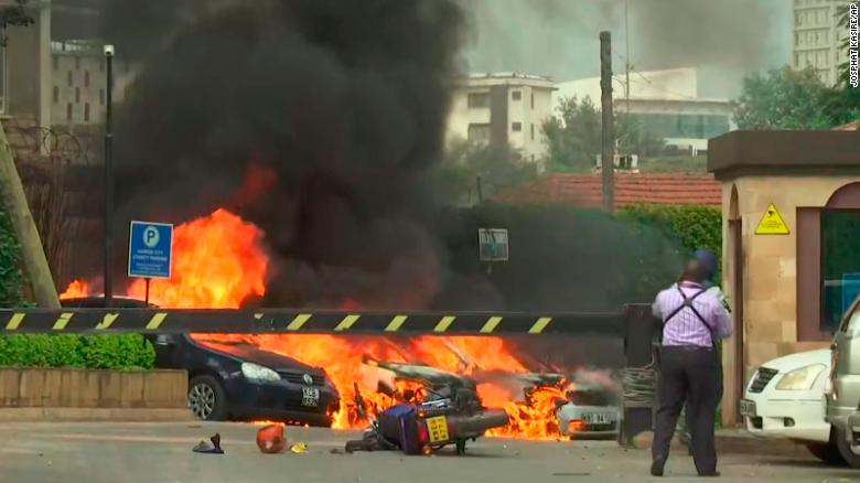 This frame taken from video shows a scene of an explosion in Kenya's capital, Nairobi, Tuesday Jan. 15, 2019. Gunfire and explosions were reported near an upscale hotel complex. (AP Photo/Josphat Kasire)
