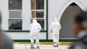 Experts work at the scene of a car bomb attack on a police cadet training school in Bogota, that left at least nine people dead and 54 injured on January 17, 2019. - Colombian authorities on Thursday named the man they suspect of carrying out a massive car bombing at a Bogota police academy that killed nine people and injured more than 50. Attorney general Nestor Humberto Martinez said Jose Aldemar Rojas Rodriguez was "the material author of this abominable crime," adding that the vehicle used in the attack contained 80 kilograms (176 pounds) of explosives. (Photo by JUAN BARRETO / AFP) (Photo credit should read JUAN BARRETO/AFP/Getty Images)