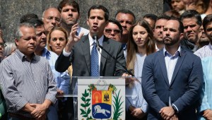 Venezuela's National Assembly head and the country's self-proclaimed "acting president" Juan Guaido (C), speaks to a crowd of opposition supporters at Bolivar Square in Chacao, eastern Caracas, on January 25, 2019. - Venezuela's opposition leader Juan Guaido called Friday for a "major demonstration" next week to demand the resignation of President Nicolas Maduro, in his first public appearance since declaring himself "acting president" two days ago. (Photo by Federico PARRA / AFP) (Photo credit should read FEDERICO PARRA/AFP/Getty Images)