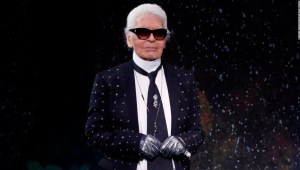 German fashion designer Karl Lagerfeld acknowledges the audience at the end of Fendi 2017-2018 fall/winter Haute Couture collection in Paris on July 5, 2017. (Photo by Patrick KOVARIK / AFP) (Photo credit should read PATRICK KOVARIK/AFP/Getty Images)