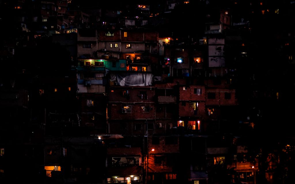 TOPSHOT - Partial view of the neighborhood Petare hill -where electric power has been restored- on March 10, 2019, during the third day of a massive power outage which has left the capital and much of the country without communications, water and electricity. - The unprecedented power outage threatens to extend indefinitely, increasing distress for the severe political and economic crisis hitting the oil-rich South American nation. (Photo by Juan BARRETO / AFP) (Photo credit should read JUAN BARRETO/AFP/Getty Images)