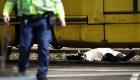 EDITORS NOTE: Graphic content / A body lying on the ground is covered near a tram at the 24 Oktoberplace in Utrecht, on March 18, 2019 where a shooting took place. - A gunman who opened fire on a tram in the Dutch city of Utrecht on March 18, injuring several people, is on the run, police said. Police only spoke of one gunman but did not rule out the possibility there might be others, the ANP news agency quoted police as saying. (Photo by Robin van Lonkhuijsen / ANP / AFP) / Netherlands OUT (Photo credit should read ROBIN VAN LONKHUIJSEN/AFP/Getty Images)