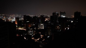 TOPSHOT - General view of Altamira neighborhood partially illuminated during a power outage in Caracas, Venezuela, on March 26, 2019. - Venezuela decreed a 24-hour holiday Tuesday to cope with a new near-nationwide blackout that the government alleged was caused by an "attack" targeting its main hydroelectric plant. (Photo by FEDERICO PARRA / AFP) (Photo credit should read FEDERICO PARRA/AFP/Getty Images)