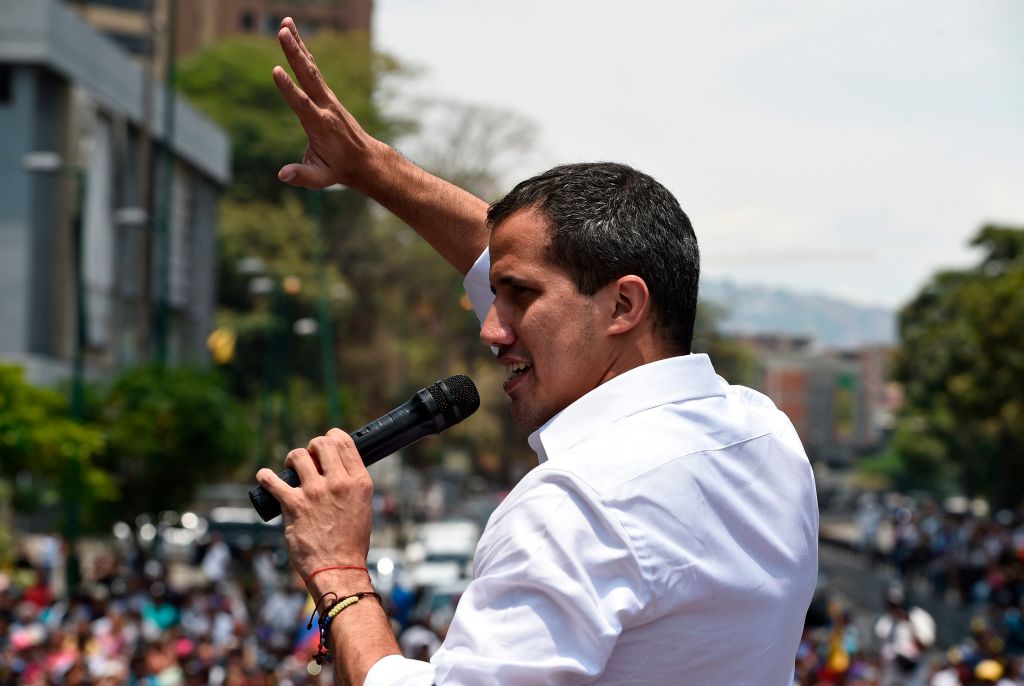 Venezuelan opposition leader Juan Guaido delivers a speech to supporters during a rally to commemorate May Day on May 1, 2019 after a day of violent clashes on the streets of the capital spurred by his call on the military to rise up against President Nicolas Maduro. - Guaido called for a massive May Day protest to increase the pressure on President Maduro. (Photo by Federico PARRA / AFP) (Photo credit should read FEDERICO PARRA/AFP/Getty Images)