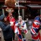 Royal super fans John Loughery (C) pops the cork on a bottle of champagne, as they stand near Windsor Castle in Windsor, west of London on May 6, 2019, following the announcement that Britain's Meghan, Duchess of Sussex has given birth to a son. - Meghan Markle, the Duchess of Sussex, gave birth on Monday to a "very healthy" boy, Prince Harry announced. "We're delighted to announce that Meghan and myself had a baby boy early this morning -- a very healthy boy," a beaming Prince Harry said. (Photo by ADRIAN DENNIS / AFP) (Photo credit should read ADRIAN DENNIS/AFP/Getty Images)