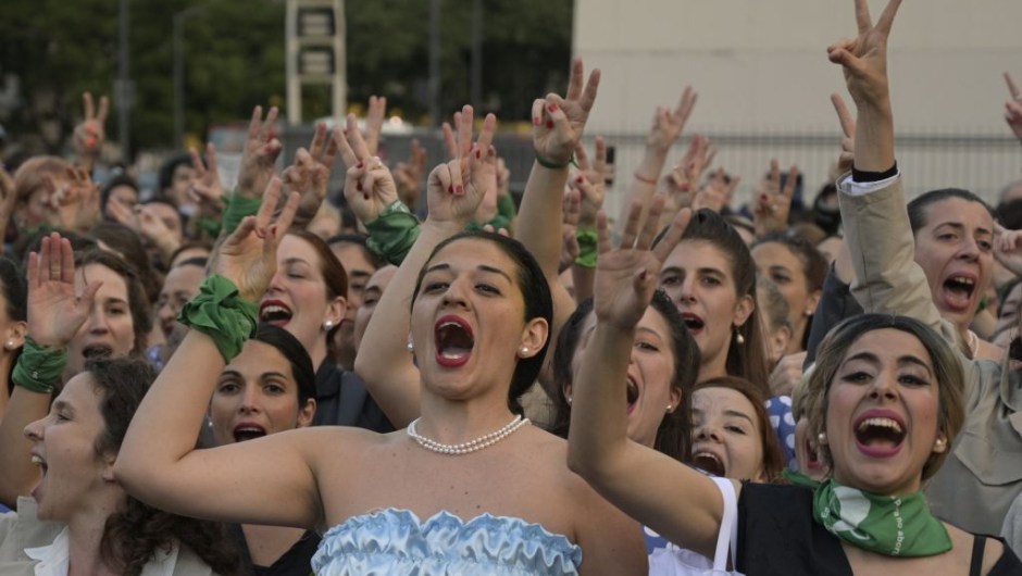 Women fancy dressed as former Argentina's First Lady (1946-1952) Eva Peron (1919-1952), shout slogans at the Republic square during a demonstration in Buenos Aires on May 6, 2019. - May 7th marks the 100th anniversary of Eva Duarte de Peron's (Evita) birth, who was called the "standard-bearer of the humble". (Photo by JUAN MABROMATA / AFP) (Photo credit should read JUAN MABROMATA/AFP/Getty Images)