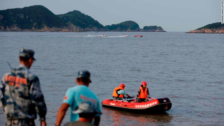 Chinese rescuers search for the 9-year-old missing girl Zhang Zixin, who was taken by a couple who later committed suicide, along the seacoast in Xiangshan county, Ningbo city, east China's Zhejiang province, 11 July 2019. The resident card of a missing girl taken away by two tenants in her home at Hangzhou was found along the Xiangshan coastline in Ningbo by search and rescue staff on Wednesday night, Qianjiang Evening News reported. Resident card issued by Hangzhou authorities can be used to travel on buses and subways or to access social security services or in libraries and parks. Hundreds of people including Xiangshan police and civilian rescue teams have taken part in the search on the sea and nearby mountains. The search scope has been narrowed to 2 kilometers along the coastline. (Imaginechina via AP Images)