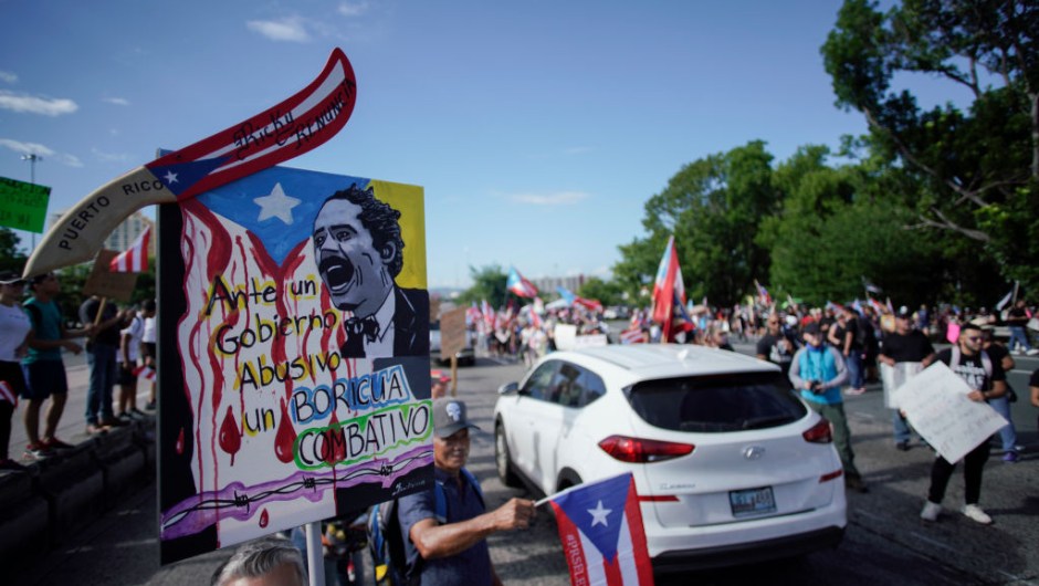 People take to the Las Americas Highway in San Juan, Puerto Rico, July 22, 2019 on day 9th of continuous protests demanding the resignation of Governor Ricardo Rosselló. - Protests erupted last week after the leak of hundreds of pages of text chats on the encrypted messaging app Telegram in which Rossello and 11 other male administration members criticize officials, politicians and journalists. In one exchange, chief financial officer Christian Sobrino makes homophobic references to Latin superstar Ricky Martin. In another, a mocking comment is made about bodies piled up in the morgue after Hurricane Maria, which left nearly 3,000 dead. (Photo by eric rojas / AFP) (Photo credit should read ERIC ROJAS/AFP/Getty Images)