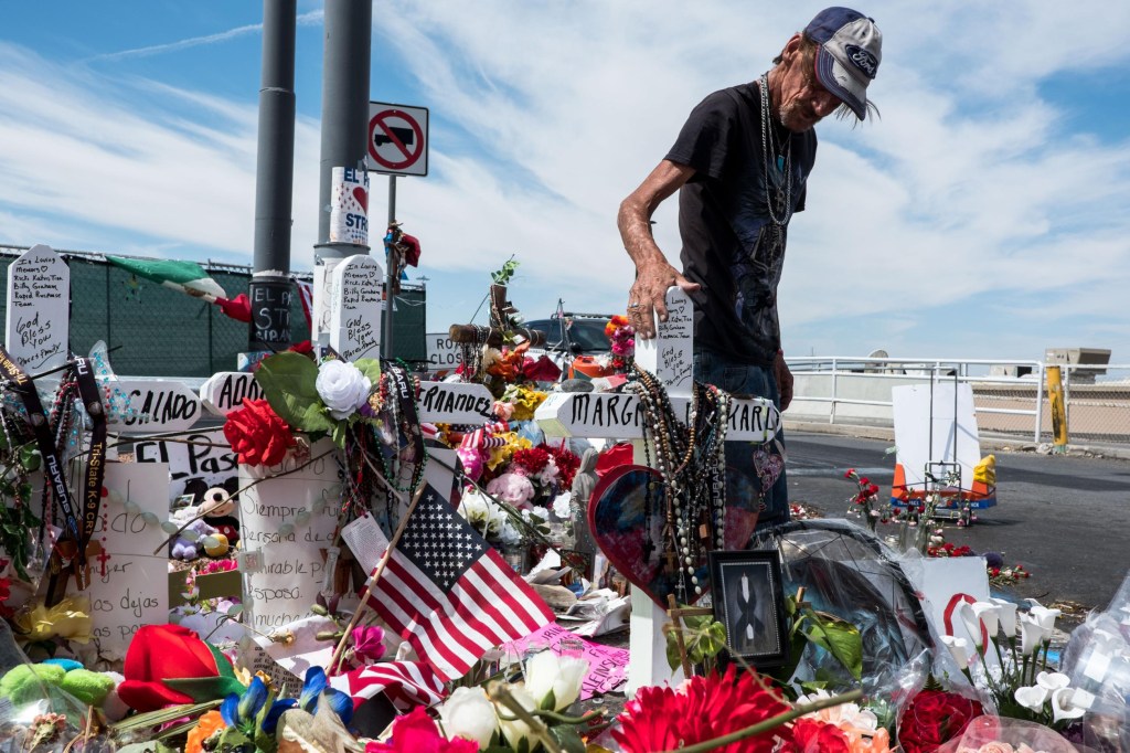 Antonio Basco visits a memorial for the victims of the Aug. 3 mass shooting in El Paso, across from the Walmart where the shooting took place in El Paso, Texas, Wednesday, Aug. 14, 2019. Basco's wife, Margie Reckard, 63, was killed in the shooting.