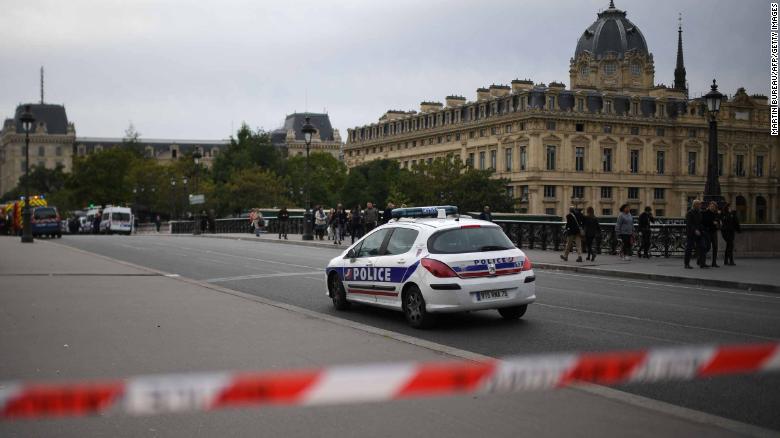 A police drives past a safety cordon near Paris prefecture de police (police headquarters) after three persons have been hurt in a knife attack on October 3, 2019. - A knife attacker was shot and injured after hurting two people at police headquarters in the historical centre of Paris on October 3, sources told AFP. (Photo by MARTIN BUREAU / AFP) (Photo by MARTIN BUREAU/AFP via Getty Images)