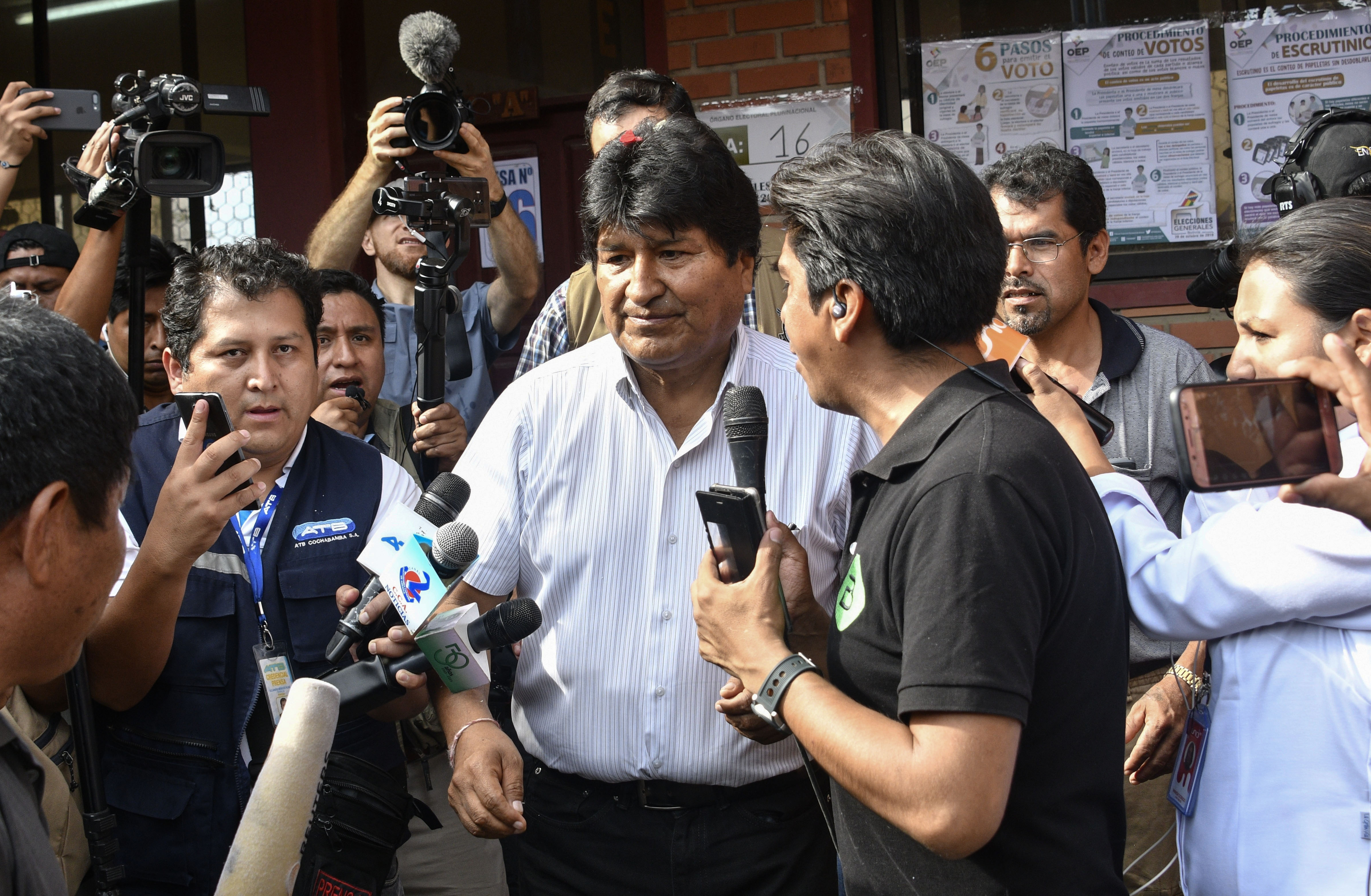 Bolivia's President and presidential candidate Evo Morales talks to the press after casting his vote during presidential elections in Villa 14 de Septiembre, Chapare, Cochabamba department, Bolivia on October 20, 2019. - Polls opened in Bolivia Sunday with Evo Morales vying for a controversial fourth term as the country's first indigenous president amid allegations of corruption and authoritarianism. (Photo by AIZAR RALDES / AFP) (Photo by AIZAR RALDES/AFP via Getty Images)