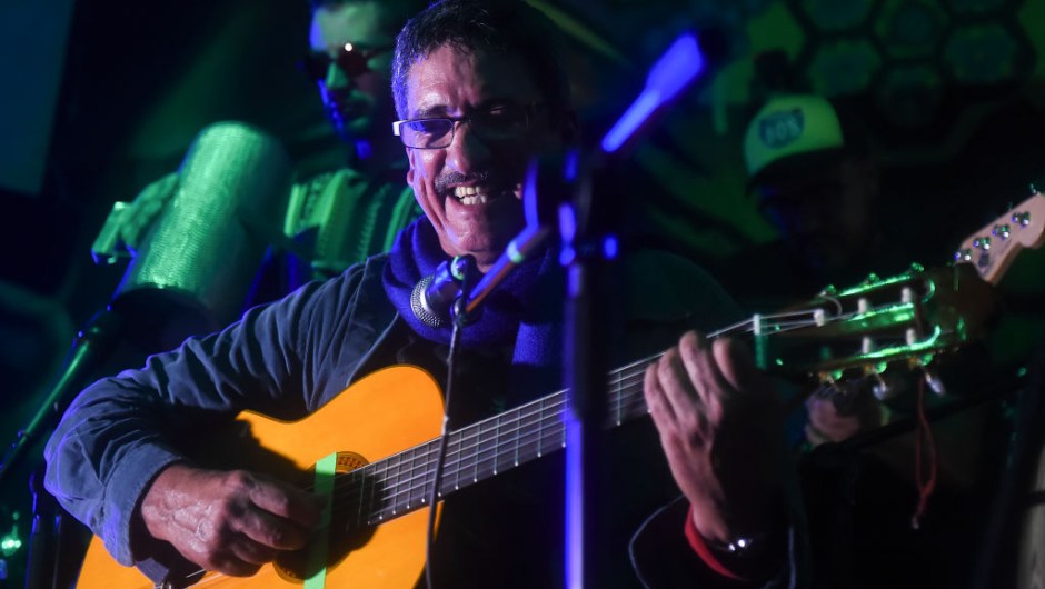Colombia's FARC member and singer Julian Conrado performs in a bar during the show "Fiesta por la Paz" (Party for Peace) in Bogota, Colombia on May 1, 2017. / AFP PHOTO / RAUL ARBOLEDA (Photo credit should read RAUL ARBOLEDA/AFP/Getty Images)