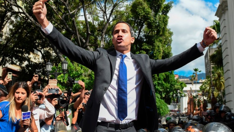 Venezuelan opposition leader and self-proclaimed acting president Juan Guaido shouts gestures on his way to the National Assembly, in Caracas, on January 7, 2020. - Opposition leader Juan Guaido and a rival lawmaker, Luis Parra -who both had claimed to be Venezuela's parliament speaker, following two separate votes and accusations of a "parliamentary coup- called for a parliamentary session today. (Photo by Cristian Hernandez / AFP) (Photo by CRISTIAN HERNANDEZ/AFP via Getty Images)