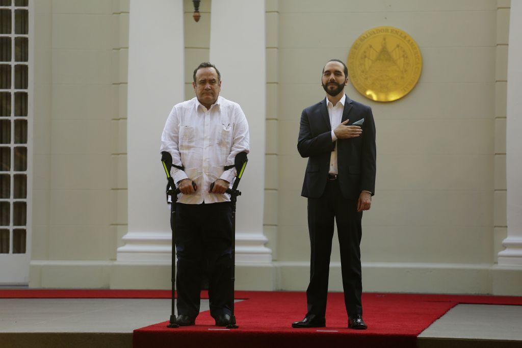 Guatemalan President Alejandro Giammattei (L) and his Salvadorean counterpart Nayib Bukele attend a welcoming ceremony at the presidential palace in San Salvador, on January 27, 2020. (Photo by MARVIN RECINOS / AFP) (Photo by MARVIN RECINOS/AFP via Getty Images)