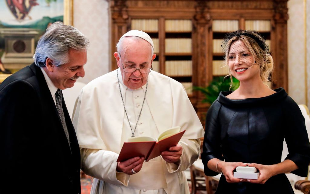 Pope Francis (C) reads a prayer for Argentina's President Alberto Fernandez (L) and Fernandez' partner Fabiola Yanez during a private audience at the Vatican on January 31, 2020. (Photo by REMO CASILLI / POOL / AFP) (Photo by REMO CASILLI/POOL/AFP via Getty Images)