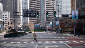 BEIJING, CHINA - FEBRUARY 03: A pedestrian crosses an empty street at a usually busy intersection in the Central Business District on February 3, 2020 in Beijing, China. China's stock markets tumbled in trading on Monday, the first day back after an extended Lunar New Year holiday as a mystery virus continues to spread in China and worldwide. The number of cases of a deadly new coronavirus rose to more than 17000 in mainland China Monday, days after the World Health Organization (WHO) declared the outbreak a global public health emergency. China continued to lock down the city of Wuhan in an effort to contain the spread of the pneumonia-like disease which medical experts have confirmed can be passed from human to human. In an unprecedented move, Chinese authorities have put travel restrictions on the city which is the epicentre of the virus and neighbouring municipalities, affecting tens of millions of people. The number of those who have died from the virus in China climbed to over 350 on Monday, mostly in Hubei province, and cases have been reported in other countries including the United States, Canada, Australia, Japan, South Korea, India, the United Kingdom, Germany, France and several others. The World Health Organization has warned all governments to be on alert and screening has been stepped up at airports around the world. (Photo by Kevin Frayer/Getty Images)
