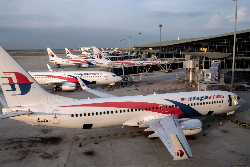 In this photo taken on February 14, 2020, Malaysia Airlines planes can be seen at the departure gates of Kuala Lumpur International Airport.  (Photo: Nicolas Asfouri/AFP/Getty Images)