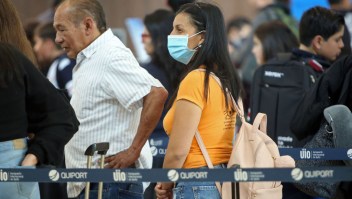 A passenger wears a protective mask at Mariscal Sucre International Airport, regarding the spread of the COVID-19 virus worldwide, in Quito, on March 1, 2020. - Ecuador confirmed on the eve its first case of the COVID-19. (Photo by Cristina Vega Rhor / AFP) (Photo by CRISTINA VEGA RHOR/AFP via Getty Images)