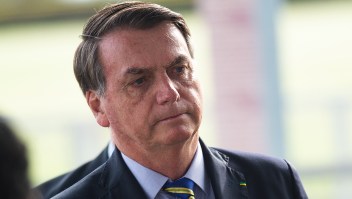 BRASILIA, BRAZIL - MAY 06: President of Brazil Jair Bolsonaro talks to supporters of his government who waited for him outside the Palácio do Alvorada amidst the coronavirus (COVID-19) pandemic on May 06, 2020 in Brasilia. Brazil has over 114,000 confirmed positive cases of Coronavirus and 7,921 deaths. (Photo by Andressa Anholete/Getty Images)