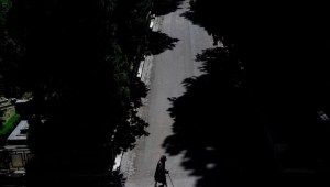 TOPSHOT - A woman walks in the Verano cemetery on May 7, 2020 in Rome, during the country's lockdown aimed at curbing the spread of the COVID-19 infection, caused by the novel coronavirus. (Photo by Filippo MONTEFORTE / AFP) (Photo by FILIPPO MONTEFORTE/AFP via Getty Images)
