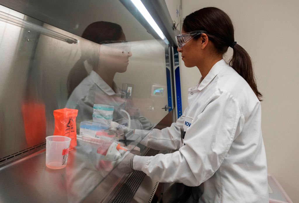 Dr. Sonia Macieiewski samples proteins at Novavax labs in Gaithersburg, Maryland on March 20, 2020, one of the labs developing a vaccine for the coronavirus, COVID-19. (Photo by ANDREW CABALLERO-REYNOLDS / AFP) / The erroneous mention[s] appearing in the metadata of this photo by ANDREW CABALLERO-REYNOLDS has been modified in AFP systems in the following manner: [Gaithersburg] instead of [Rockville]. Please immediately remove the erroneous mention[s] from all your online services and delete it (them) from your servers. If you have been authorized by AFP to distribute it (them) to third parties, please ensure that the same actions are carried out by them. Failure to promptly comply with these instructions will entail liability on your part for any continued or post notification usage. Therefore we thank you very much for all your attention and prompt action. We are sorry for the inconvenience this notification may cause and remain at your disposal for any further information you may require. (Photo by ANDREW CABALLERO-REYNOLDS/AFP via Getty Images)