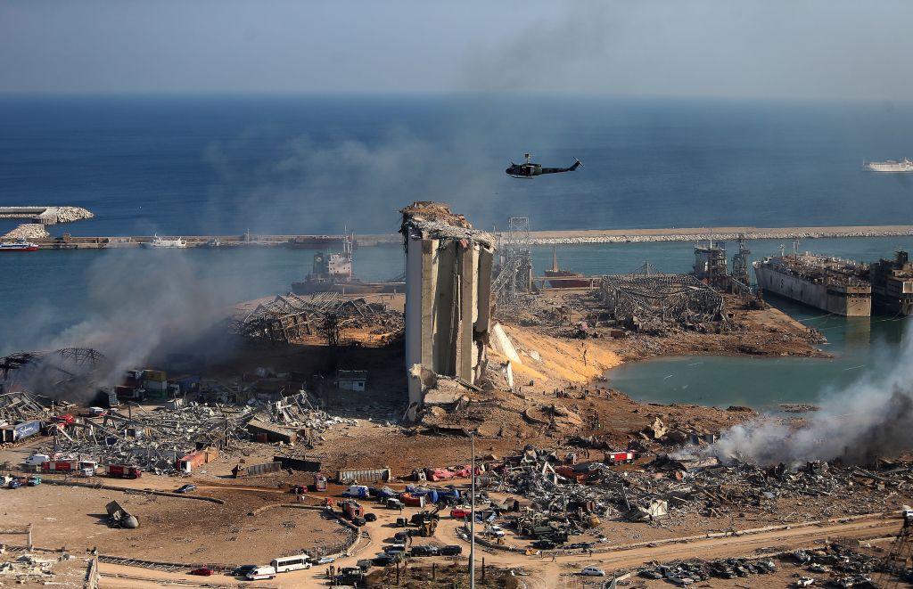 TOPSHOT - A general view shows the damaged grain silos of Beirut's harbour and its surroundings on August 5, 2020, one day after a powerful twin explosion tore through Lebanon's capital, resulting from the ignition of a huge depot of ammonium nitrate at the city's main port. - Rescuers searched for survivors in Beirut after a cataclysmic explosion at the port sowed devastation across entire neighbourhoods, killing more than 100 people, wounding thousands and plunging Lebanon deeper into crisis. The blast, which appeared to have been caused by a fire igniting 2,750 tonnes of ammonium nitrate left unsecured in a warehouse, was felt as far away as Cyprus, some 150 miles (240 kilometres) to the northwest. (Photo by STR / AFP) (Photo by STR/AFP via Getty Images)