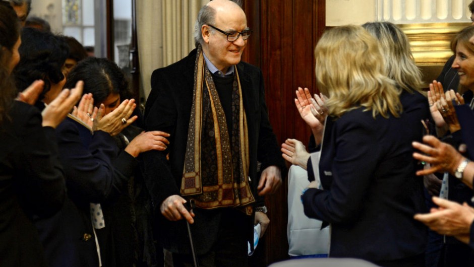 Argentine cartoonist Joaquin Lavado, known by his pen name Quino (C), creator of the famous cartoon strip Mafalda -translated to 15 languages- is applauded during a tribute ceremony for his 80th birthday held at the Argentine Congress in Buenos Aires on August 30, 2012. The cartoonist gained international recognition in 1969 with the European publication of "Mafalda, la contestataria" (Mafalda, the rebel") with a prologue by Italian writer Umberto Eco. AFP PHOTO / DANIEL GARCIA (Photo by DANIEL GARCIA / AFP) (Photo by DANIEL GARCIA/AFP via Getty Images)