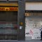 A woman walks past a closed hotel and restaurant on Gran Via, the main avenue of central Madrid, on October 16, 2020. - The coronavirus pandemic has pulverised Spain's tourism-dependent economy, with the government warning that GDP would fall by 11.2 percent this year, down from a previous prediction in May for a 9.2 percent decline. (Photo by GABRIEL BOUYS / AFP) (Photo by GABRIEL BOUYS/AFP via Getty Images)