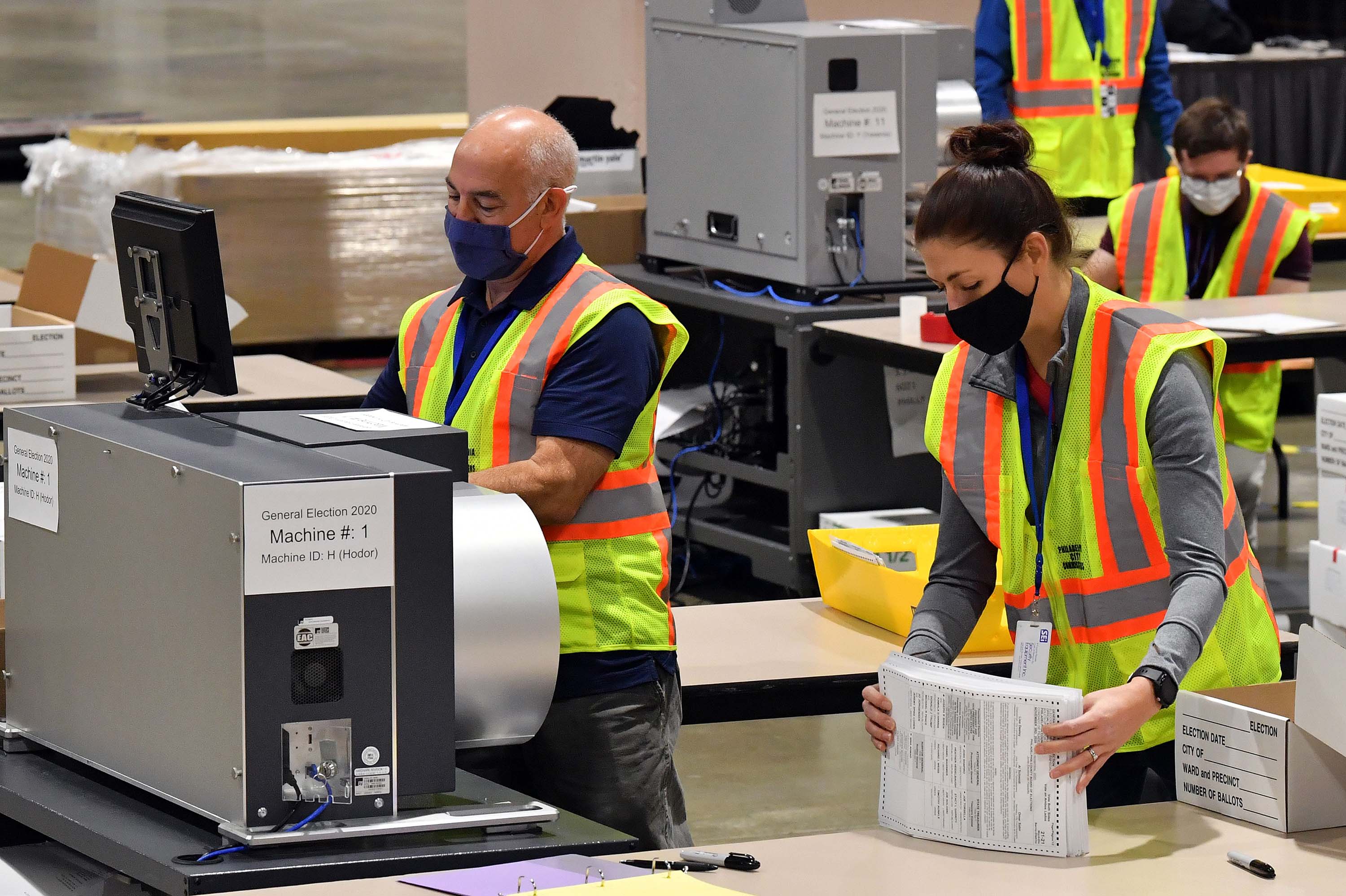 Mandatory Credit: Photo by Andrew H. Walker/Shutterstock (10996242r) Philadelphia County employees continue to open, sort and count mail-in ballots a day after the 2020 Presidential Election in Philadelphia, Pennsylvania. US Presidential election, Pennsylvania, USA - 04 Nov 2020