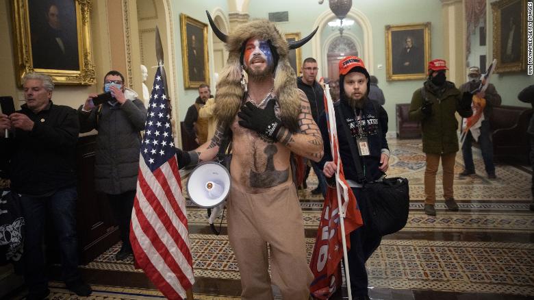 QAnon, Proud Boys and others in capitulation in Capitol