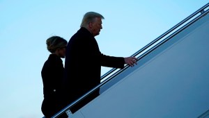 US President Donald Trump and First Lady Melania Trump board Air Force One at Joint Base Andrews in Maryland on January 20, 2021. - President Trump travels to his Mar-a-Lago golf club residence in Palm Beach, Florida, and will not attend the inauguration for President-elect Joe Biden. (Photo by ALEX EDELMAN / AFP) (Photo by ALEX EDELMAN/AFP via Getty Images)