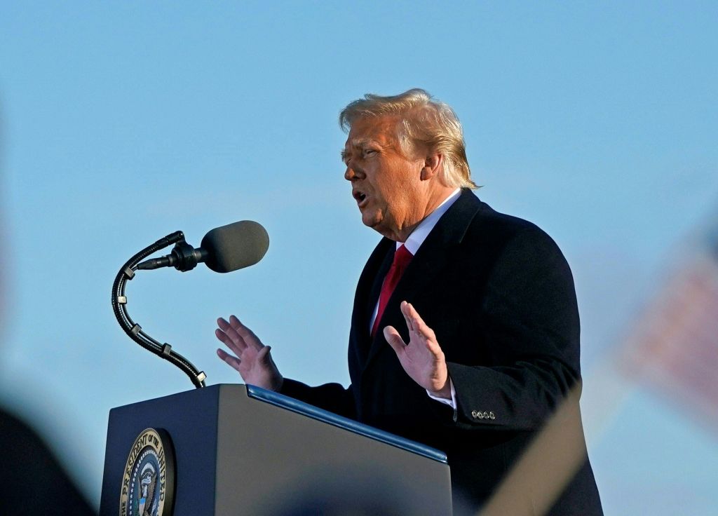 Outgoing US President Donald Trump addresses guests at Joint Base Andrews in Maryland on January 20, 2021. - President Trump and the First Lady travel to their Mar-a-Lago golf club residence in Palm Beach, Florida, and will not attend the inauguration for President-elect Joe Biden. (Photo by ALEX EDELMAN / AFP) (Photo by ALEX EDELMAN/AFP via Getty Images)
