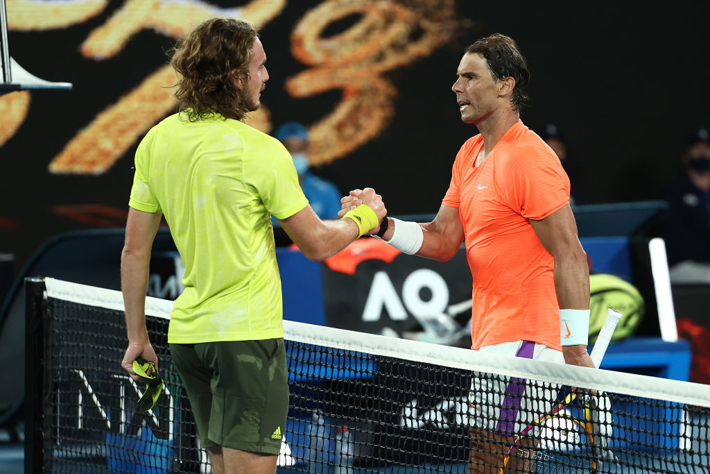 Tsitsipas Nadal MELBOURNE, AUSTRALIA - FEBRUARY 17: Stefanos Tsitsipas of Greece (L) embraces Rafael Nadal of Spain following victory in his Men’s Singles Quarterfinals match during day 10 of the 2021 Australian Open at Melbourne Park on February 17, 2021 in Melbourne, Australia. (Photo by Cameron Spencer/Getty Images)
