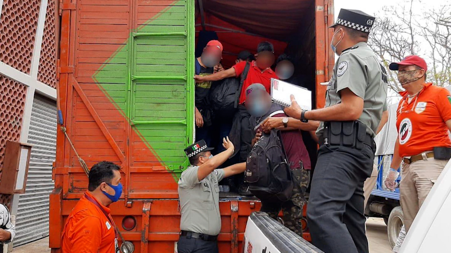 find more than 300 migrants hacked in trucks