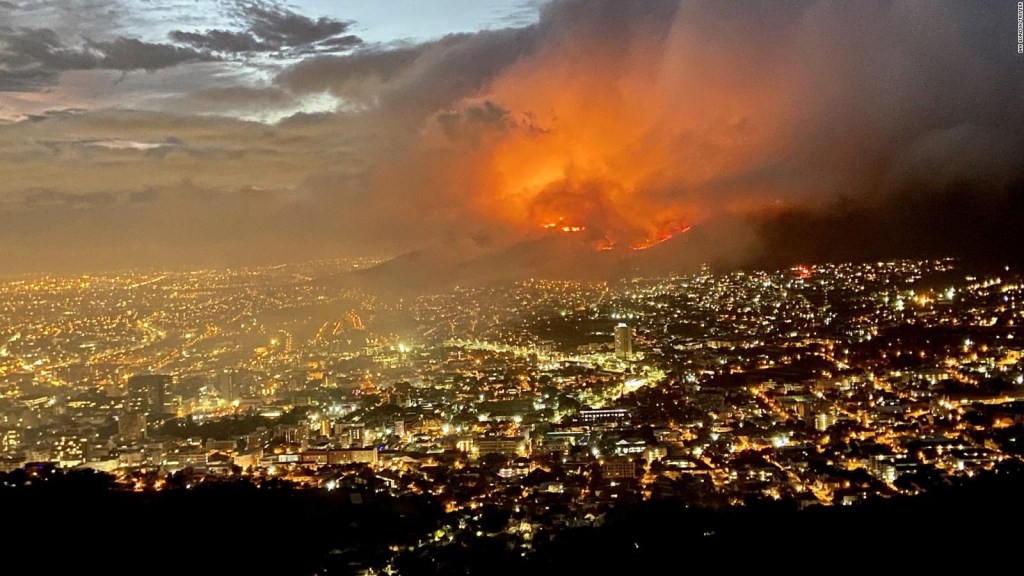 Firefighters try to put out a fire in South Africa