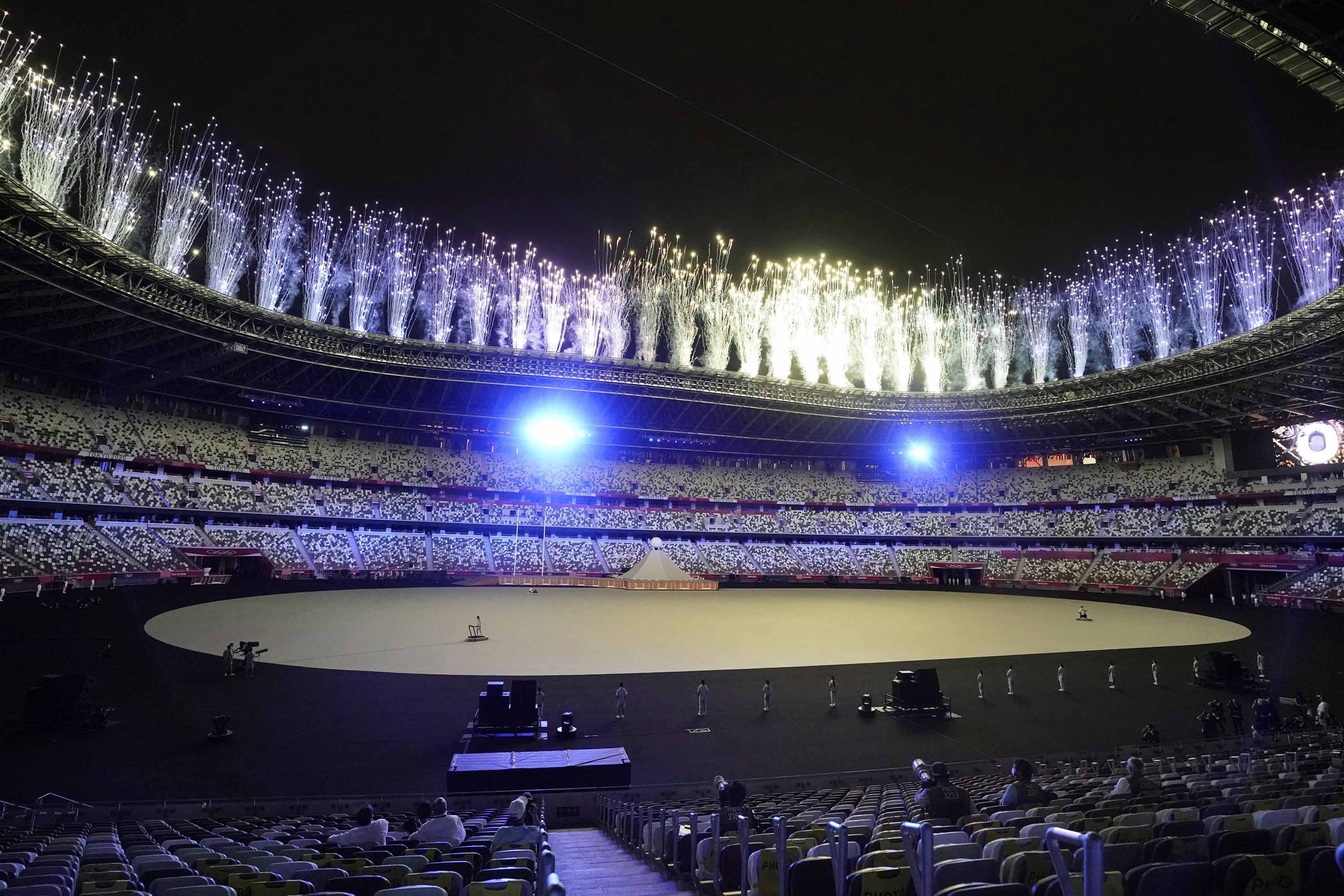Fireworks soar above the National Stadium during the opening ceremony of the Tokyo Olympics on July 23, 2021, in Tokyo. (Photo by Kyodo News via Getty Images)