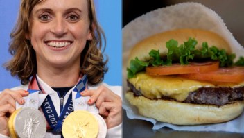 Atleta gana medalla de oro y lo celebra con hamburguesa