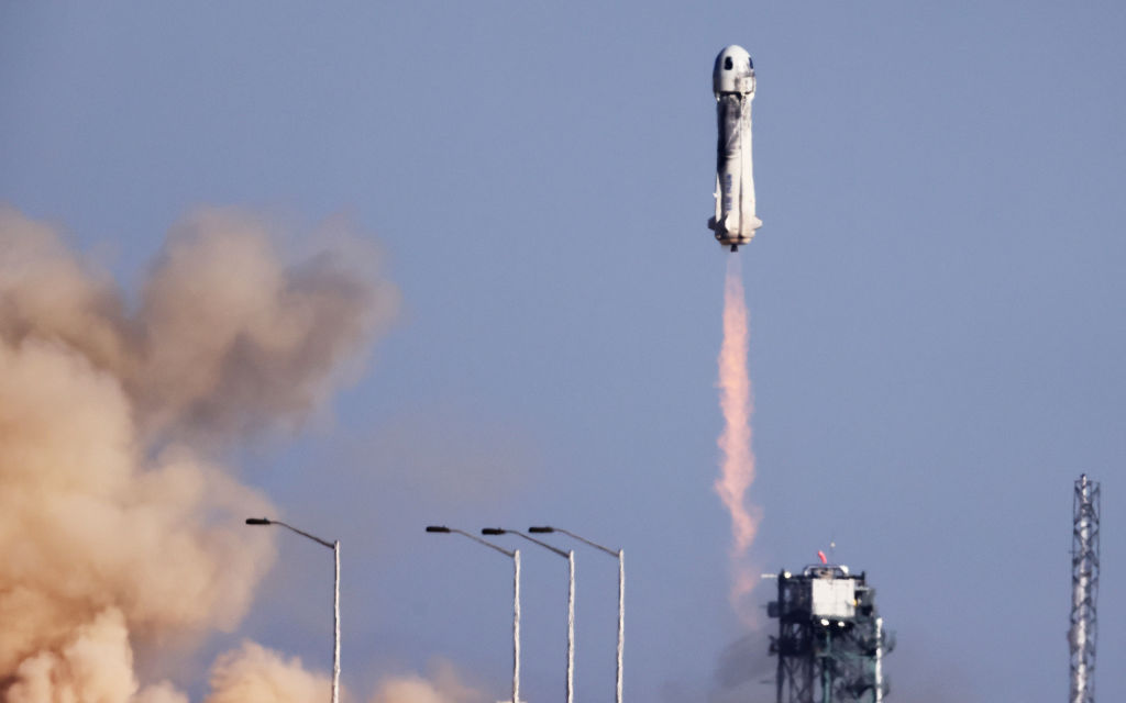 VAN HORN, TEXAS - OCTOBER 13: Blue Origin’s New Shepard lifts off from the launch pad carrying 90-year-old Star Trek actor William Shatner and three other civilians on October 13, 2021 near Van Horn, Texas. Shatner will become the oldest person to fly into space on the ten minute flight. Shatner, along with civilians Audrey Powers, Chris Boshuizen and Glen de Vries, and are riding aboard mission NS-18, the second human spaceflight for the company which is owned by Amazon founder Jeff Bezos. (Photo by Mario Tama/Getty Images)